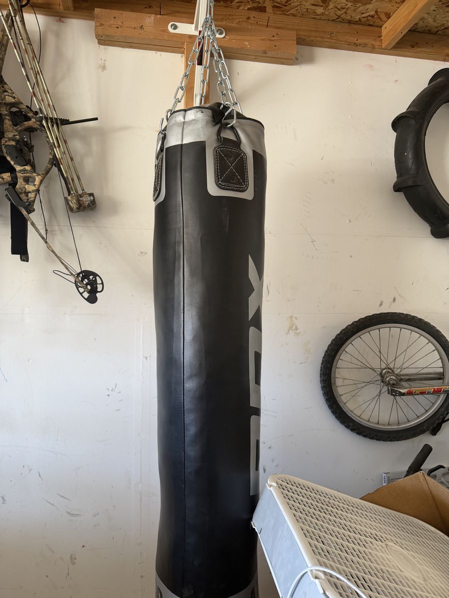 Punching bag with mounting hardware