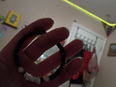 Handmade Black and White Beaded Bracelet with Shell Accents