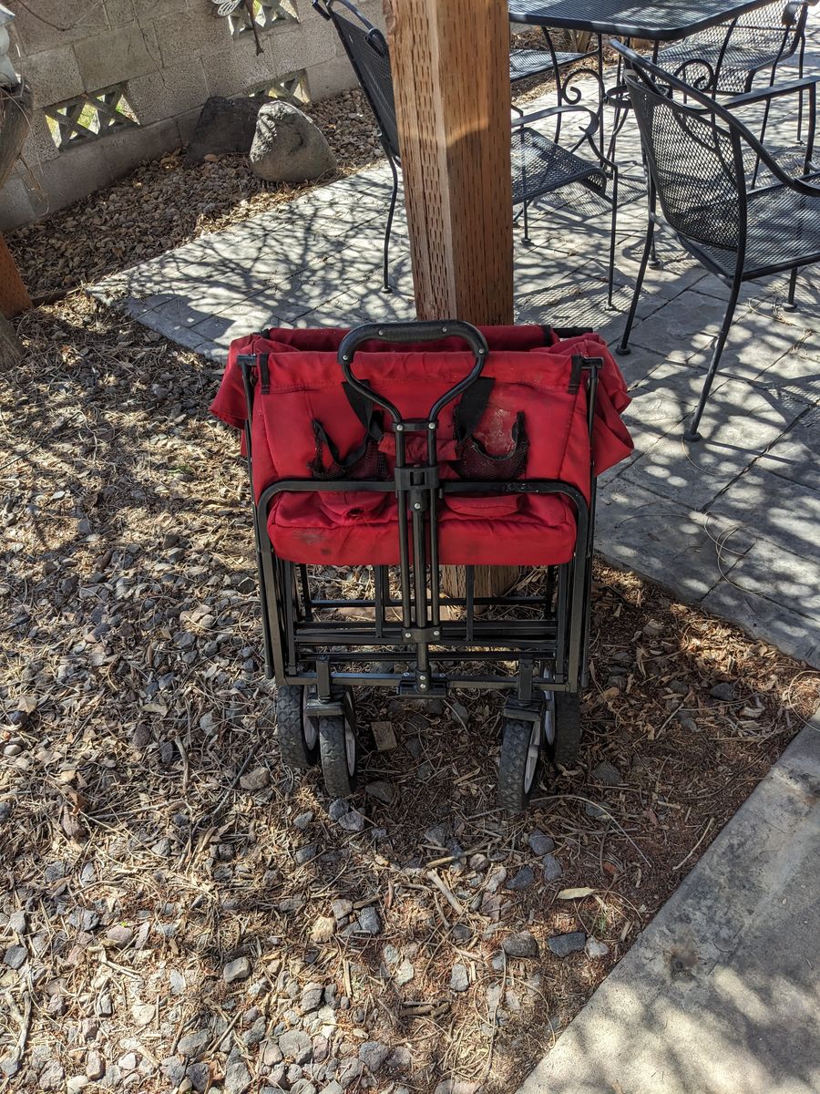Long, foldable wagon.