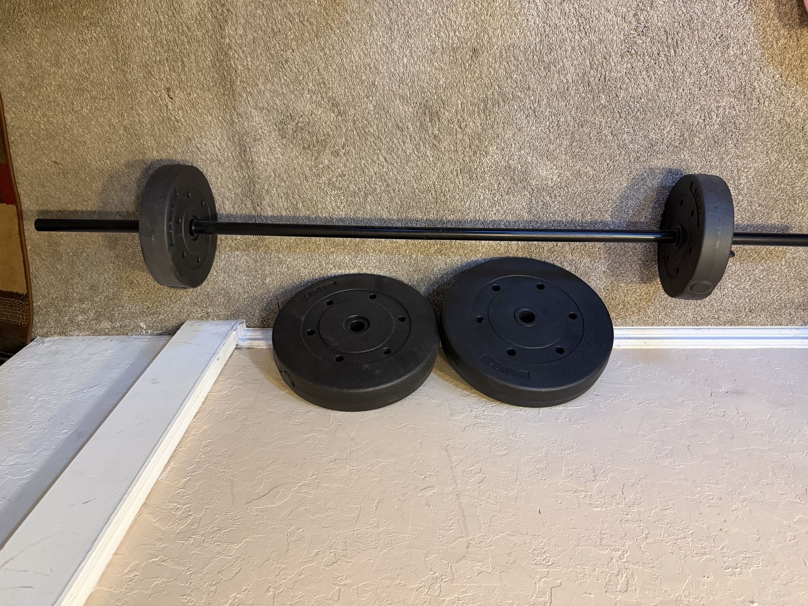 Standard Barbell with two 25Ib and two 10Ib Weight Plates
