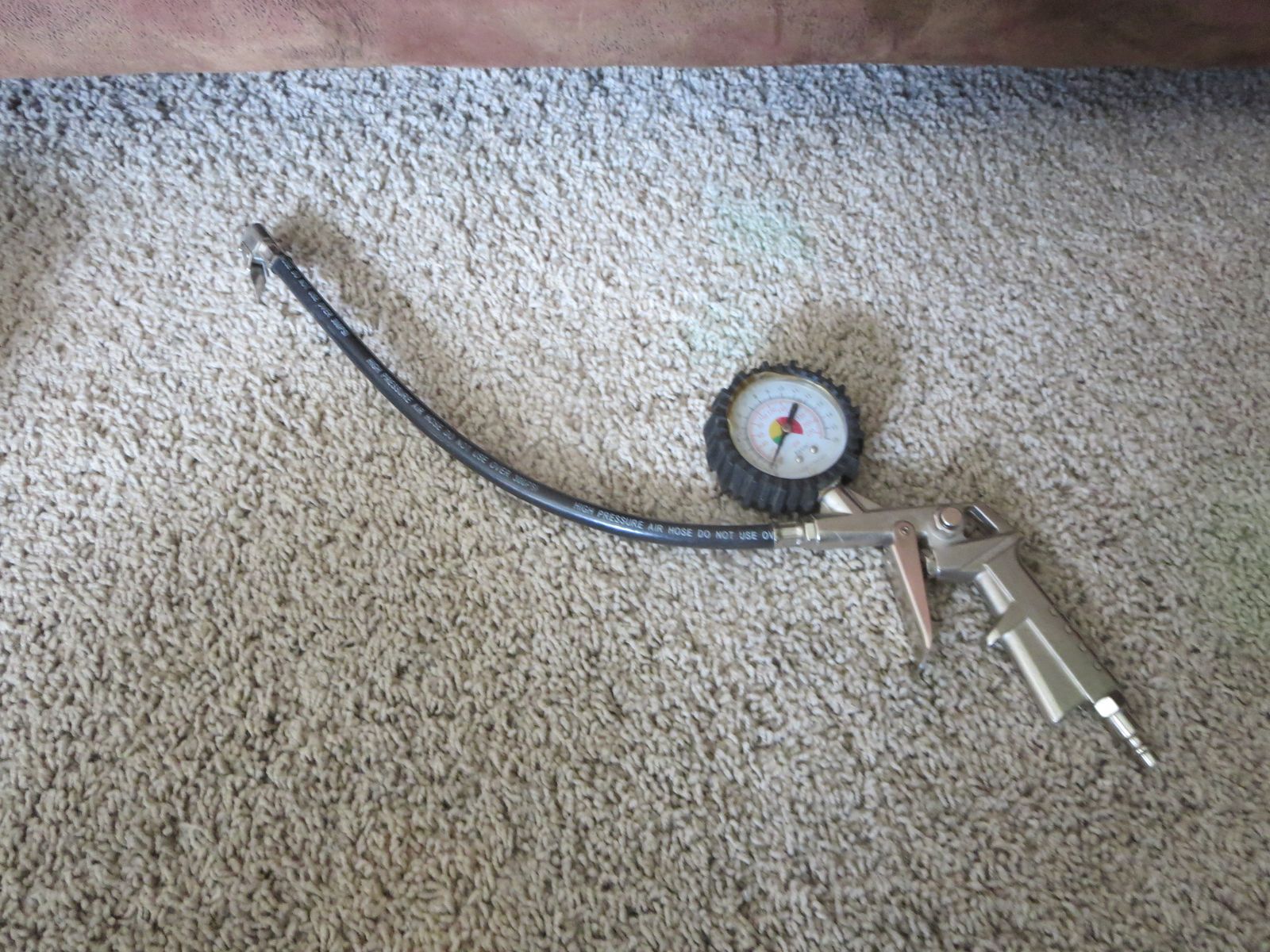Tire inflator with gauge