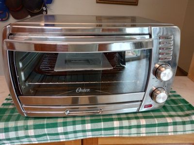 Oster TSSTTVSKBT 6-Slice Stainless Steel Countertop Toaster Oven with User Manual
