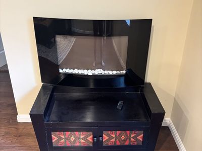 Electric Fireplace with Black Finish and Decorative Cabinet Stand