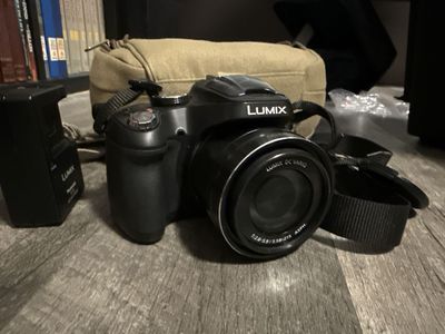 Panasonic Lumix DMC-FZ70 Digital Camera with 60x Optical Zoom, Case & 16GB SD Card