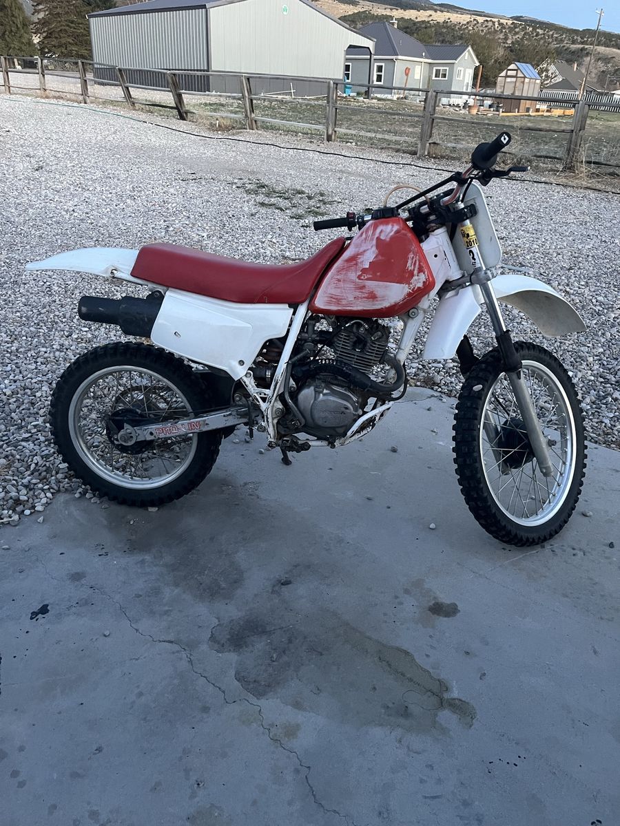 1990 xr 200, 1997 arctic cat 454, and 2003 400