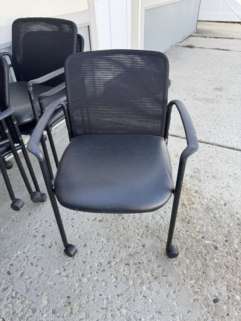 Eight Stackable Rolling Chairs