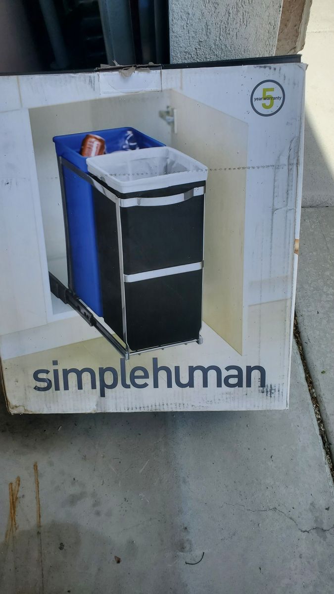 Under cabinet pull-out trash and recycling bins
