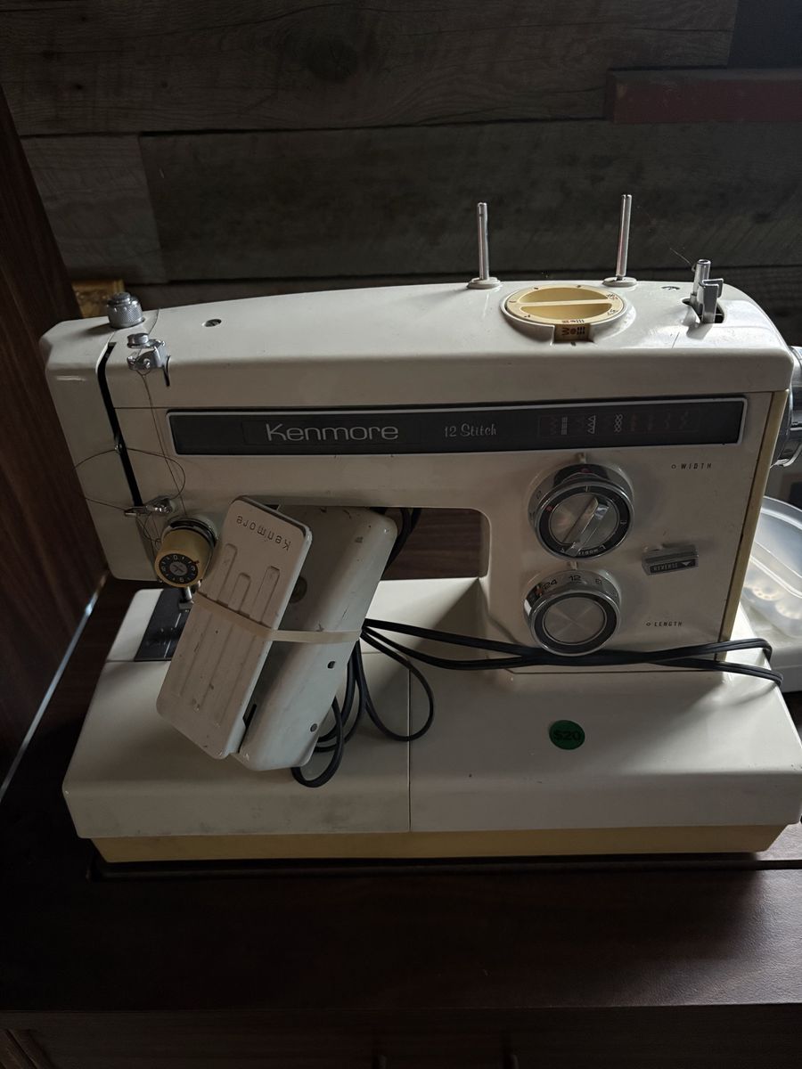 Kenmore 12 Stitch Vintage Sewing Machine with Foot Pedal and drop leaf sewing cabinet.
