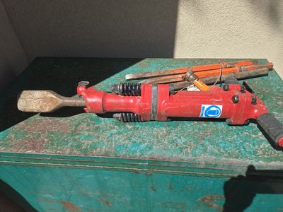 Pneumatic jackhammer with 4 bits.