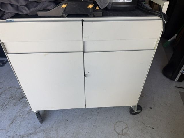 one metal cabinet with wheel and elctrical 