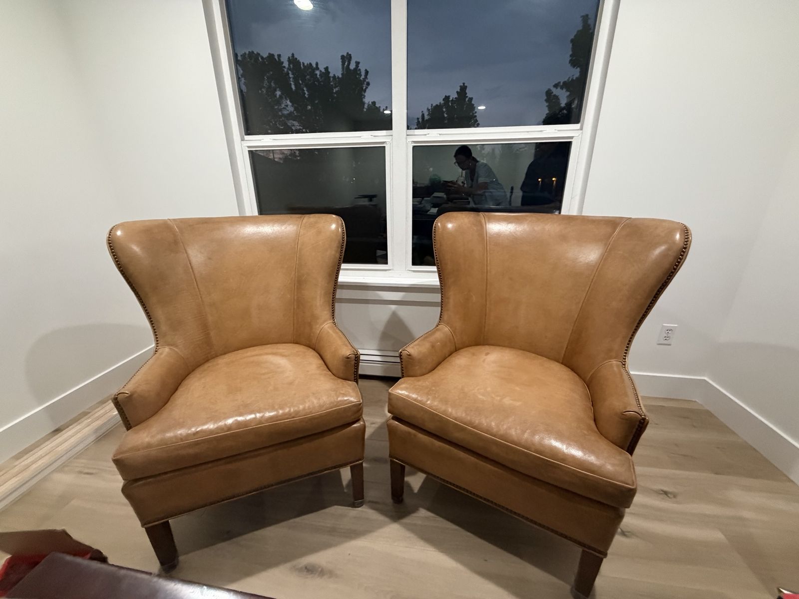 Pair of Tan Leather Wingback Armchairs with Nailhead Trim