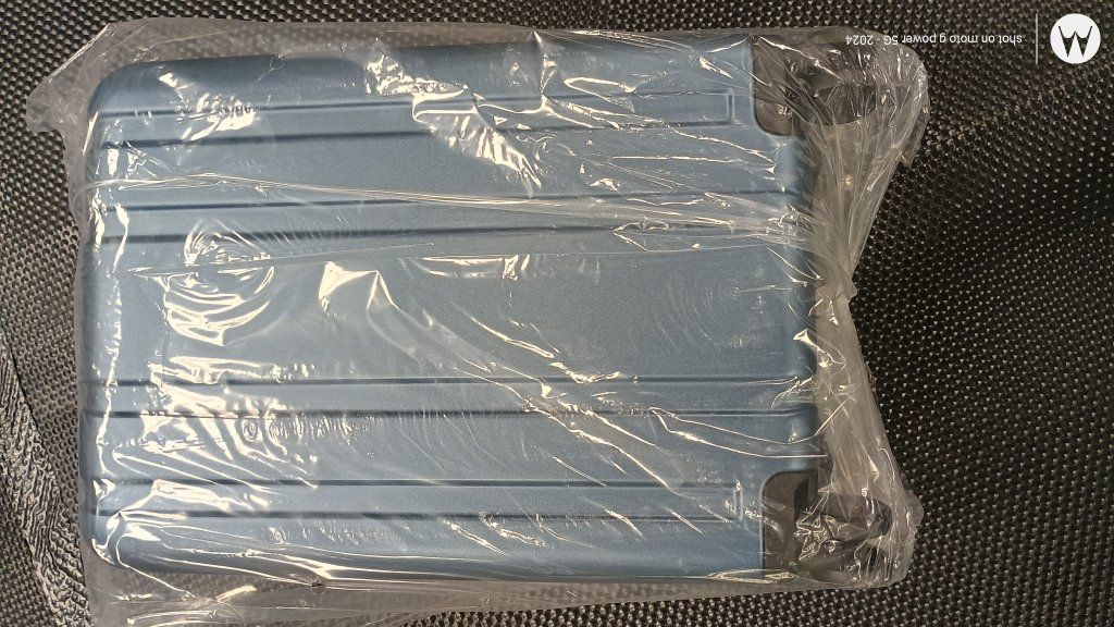 new in packaging blue 20inch hardshell suitcase