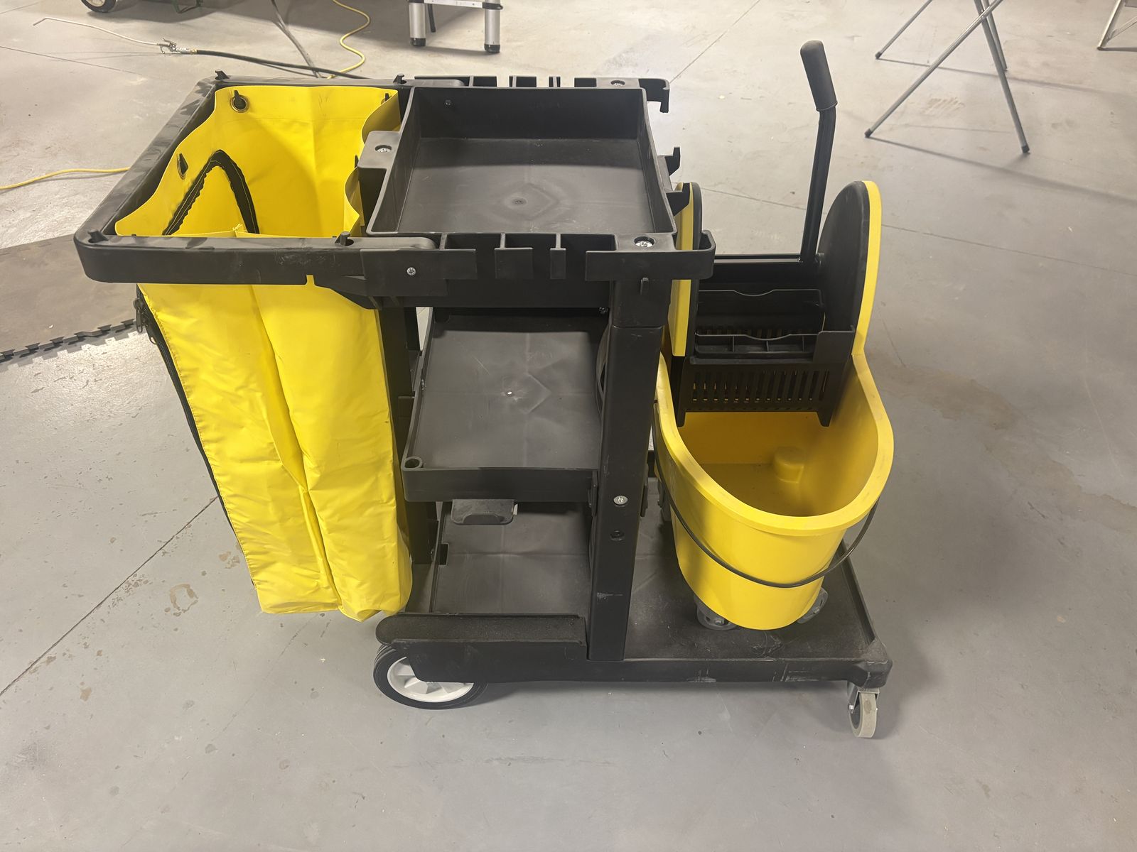 Brand new janitor/maid cart with 35 qt down press mop system