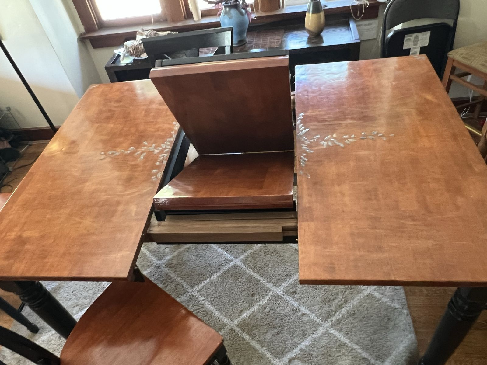 Extendable Wooden Dining Table with Leaf and Black Legs plus 6 matching chairs