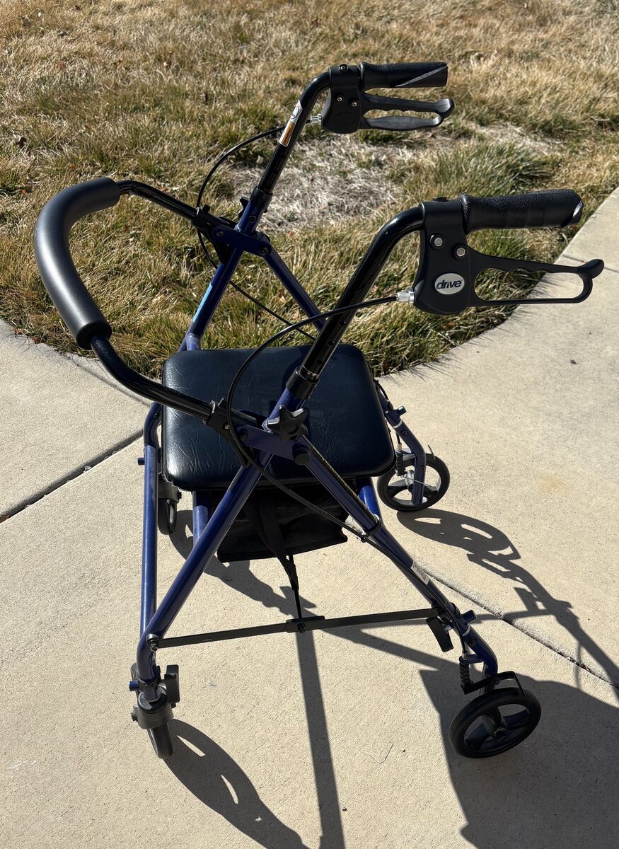 DRIVE senior walker with folding seat compartment and back support