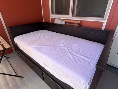 Twin sized daybed, converts to a queen bed.