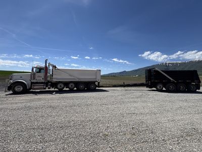 2021 Peterbilt dump truck paired with a 2020 4-axle pup trailer