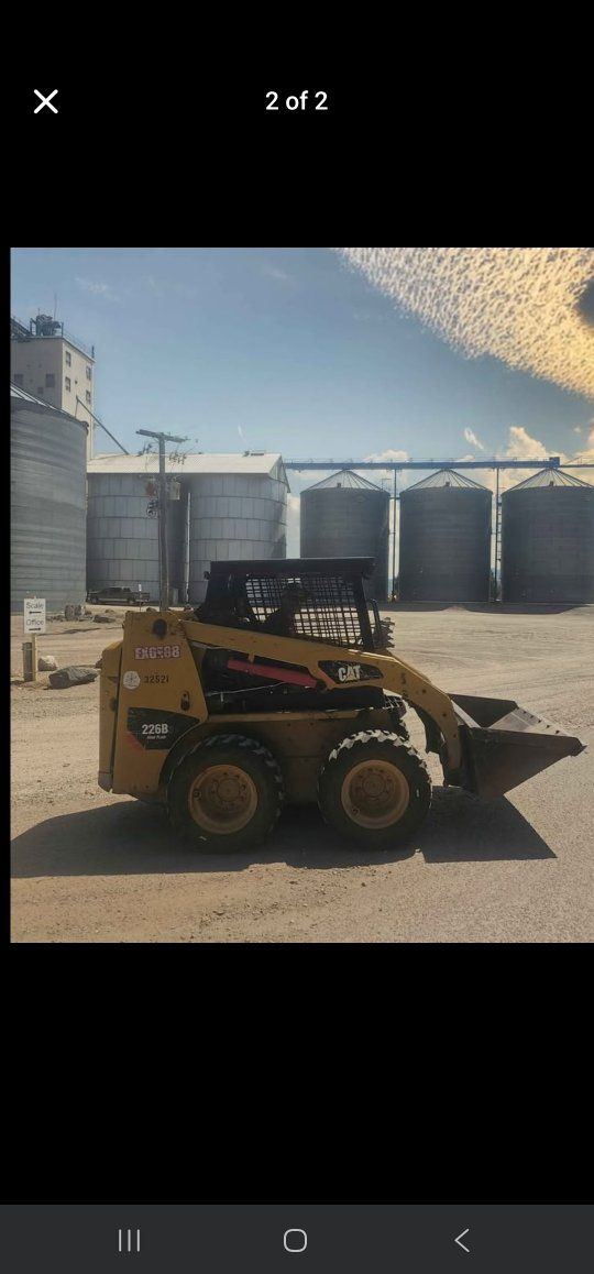 Skidsteer and 7x14' dump trailer