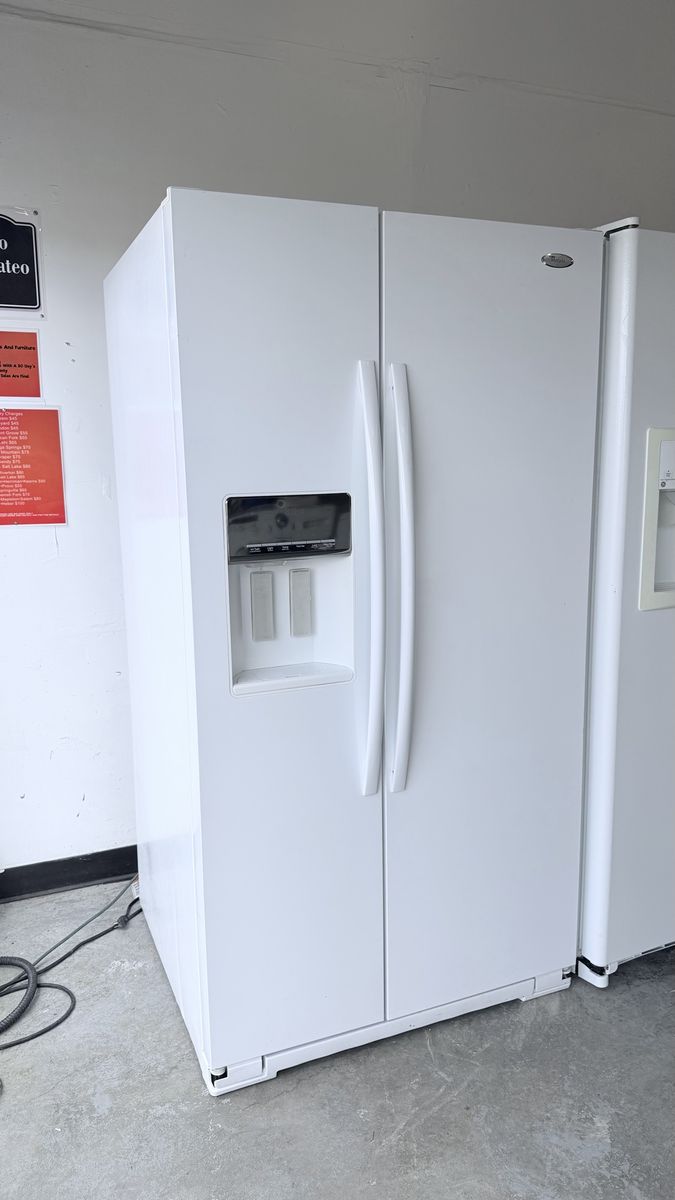 White Whirlpool Side-by-Side Refrigerator with Water and Ice Dispenser