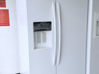 White Whirlpool Side-by-Side Refrigerator with Water and Ice Dispenser