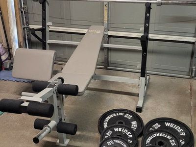 Bench and 253 pounds of weights