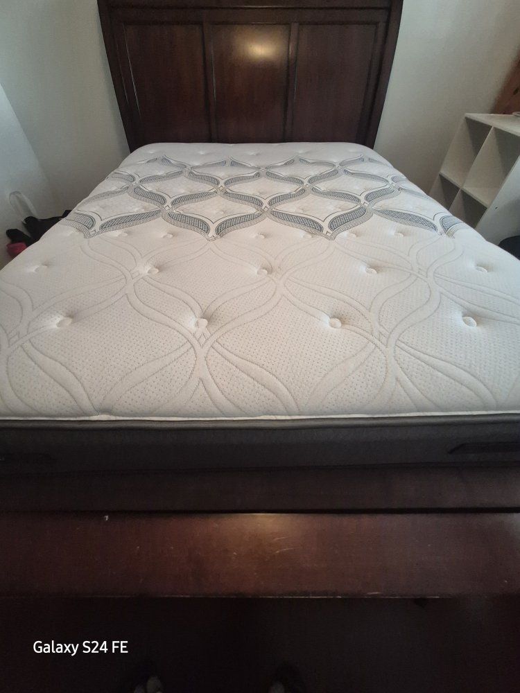 Moving Sale! Dark Wood solid. Queen Size Bed Frame and Mattress Set.$480.00 cash.