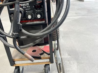 Century 130 MIG Wire Feed Welder (30-130 Amp) with Cart, & Accessories