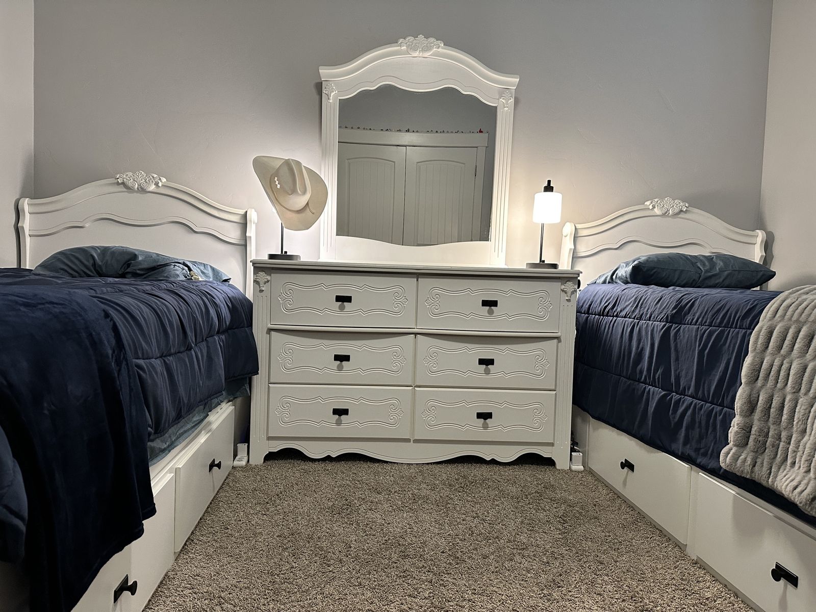 Two twin bed set including dresser with mirror