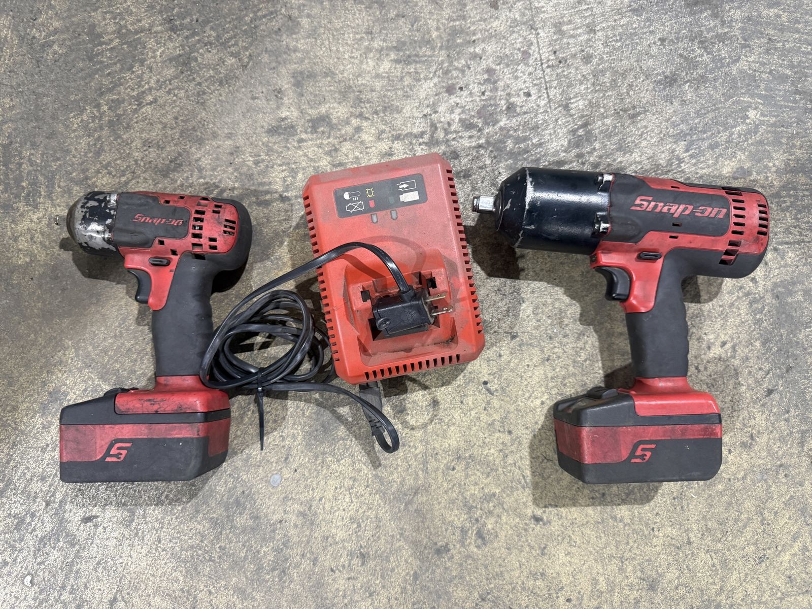 Snap on 1/2 and 3/8 impact guns with batteries