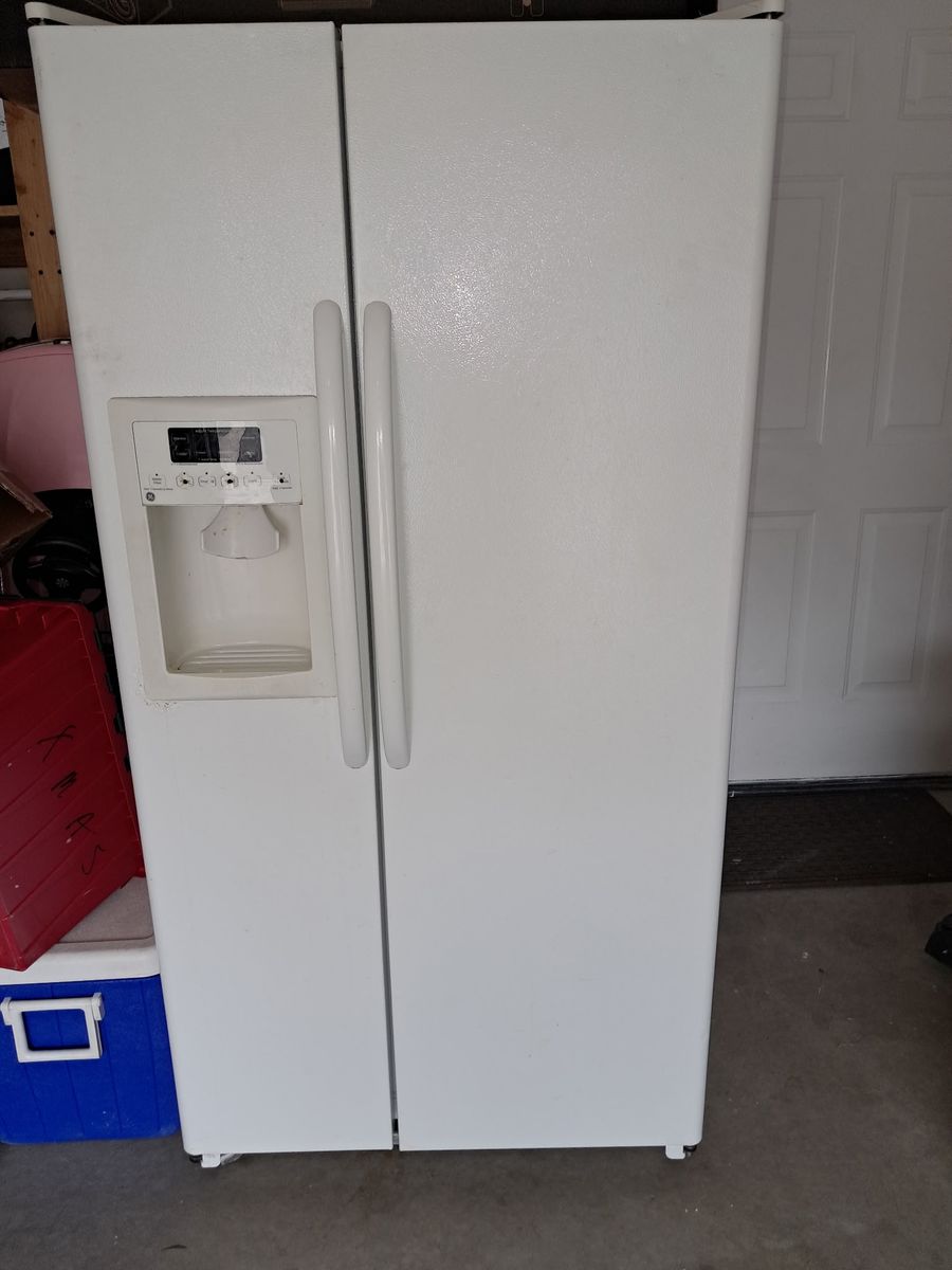 FREE-GE side by side refridgerator/freezer with water filter and icemaker. Needs work.