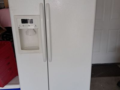 FREE-GE side by side refridgerator/freezer with water filter and icemaker. Needs work.