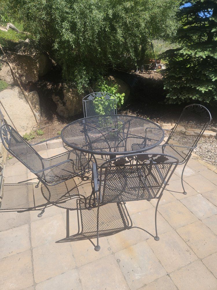 wrought iron table and 4 chairs