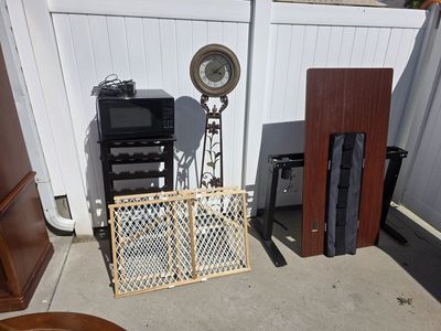 entertainment center and matching coffee table and other miscellaneous items.