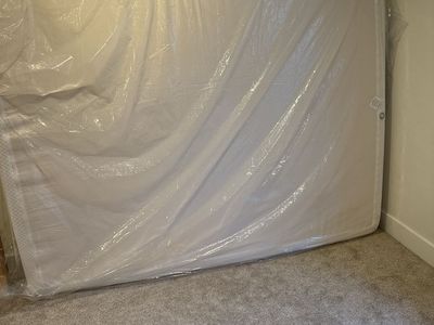 White Memory Foam Mattress Wrapped in Protective Plastic Cover Queen