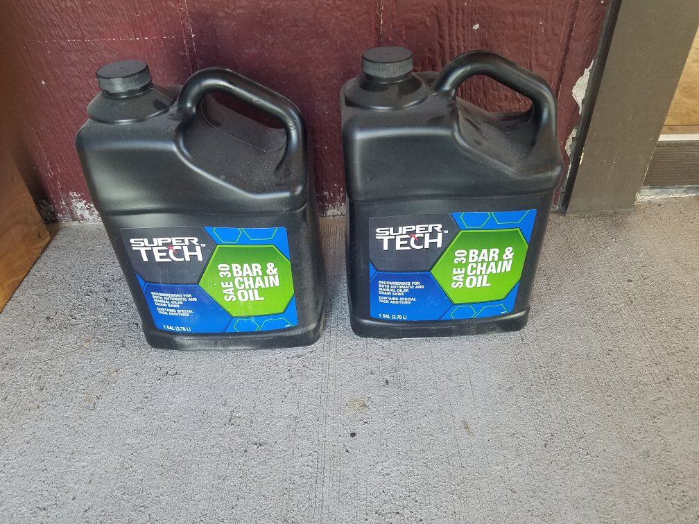 Two One Gallon Bottles of Chainsaw Bar Oil