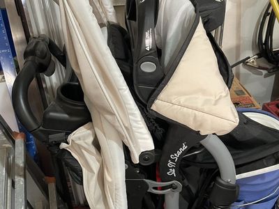 Sit and stand double stroller with car seats and bases