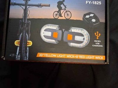 FY-1825 Remote Steering Tail Light with Turn Signals & USB Charging - New Bicycle Safety Light