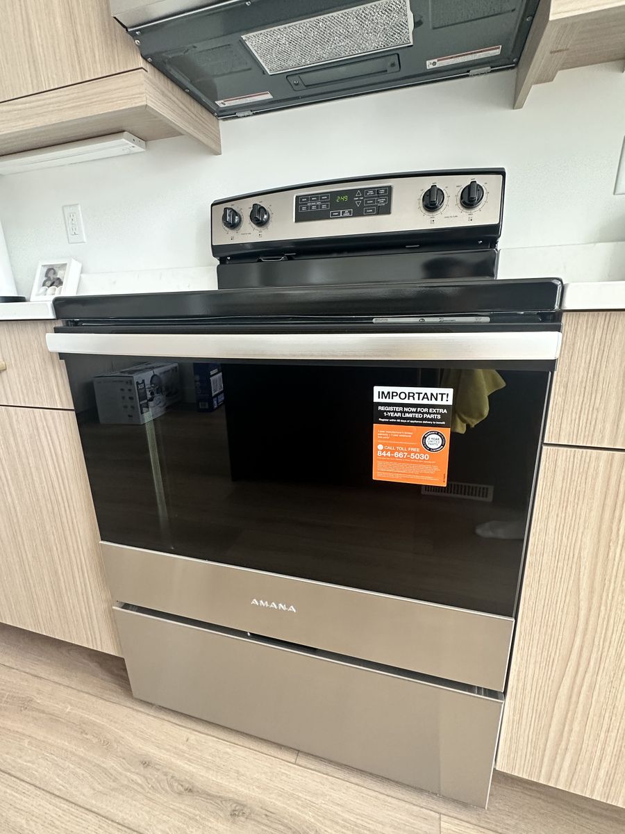 NEW 30-INCH AMANA® ELECTRIC RANGE WITH EXTRA-LARGE OVEN WINDOW