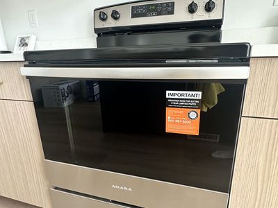 NEW 30-INCH AMANA® ELECTRIC RANGE WITH EXTRA-LARGE OVEN WINDOW