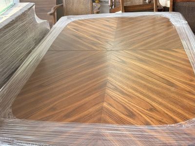 Wood dining room table with six chairs and two leafs