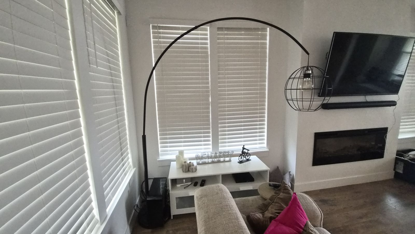 Industrial Style Arched Floor Lamp with Exposed Bulb & Spherical Metal Cage Shade