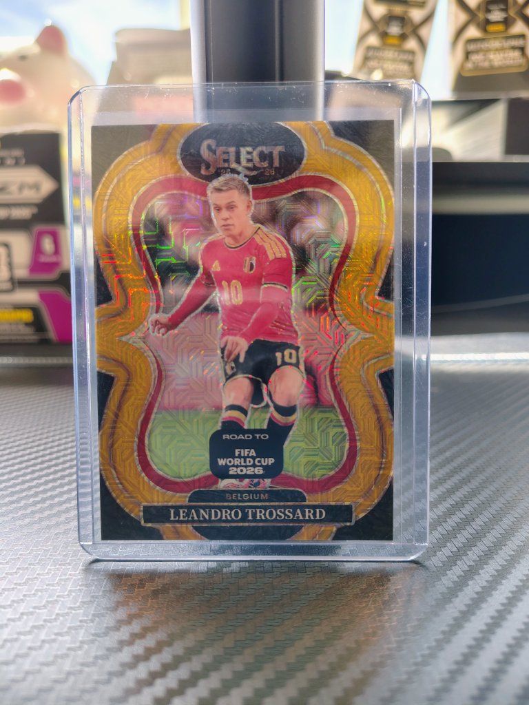 2025-26 Panini Select Leandro Trossard (06/10) Belgium Gold Mezzanine Prizm Soccer Card No. 161