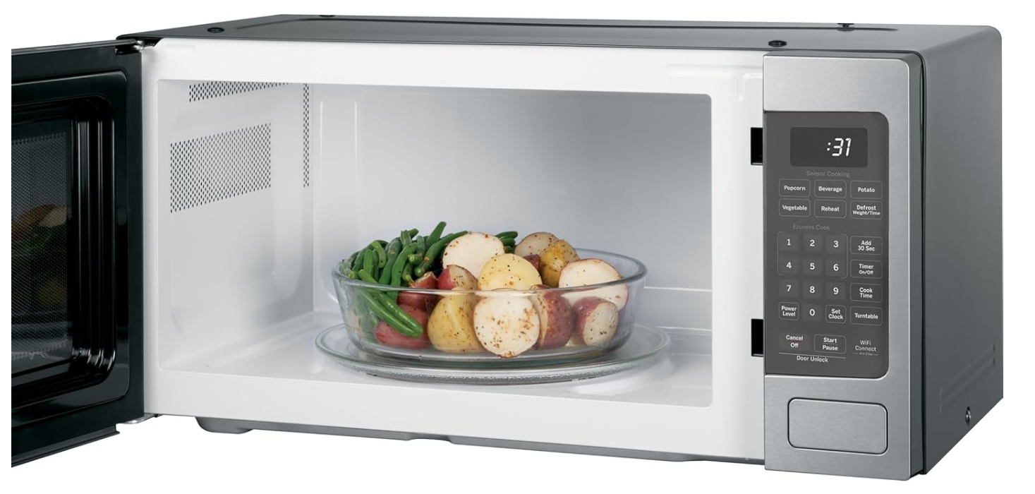 New in box GE 1.1 Cu Ft Countertop Microwave