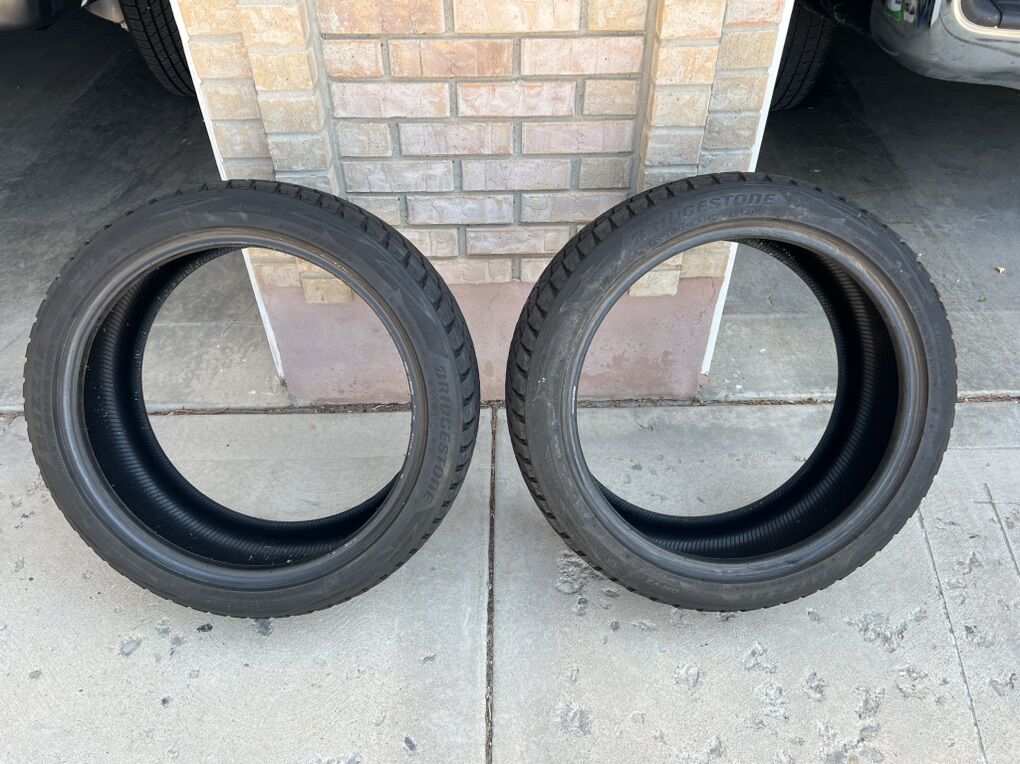 A Pair of Used 235/45R20 Bridgestone Blizzak DM-V2 100S