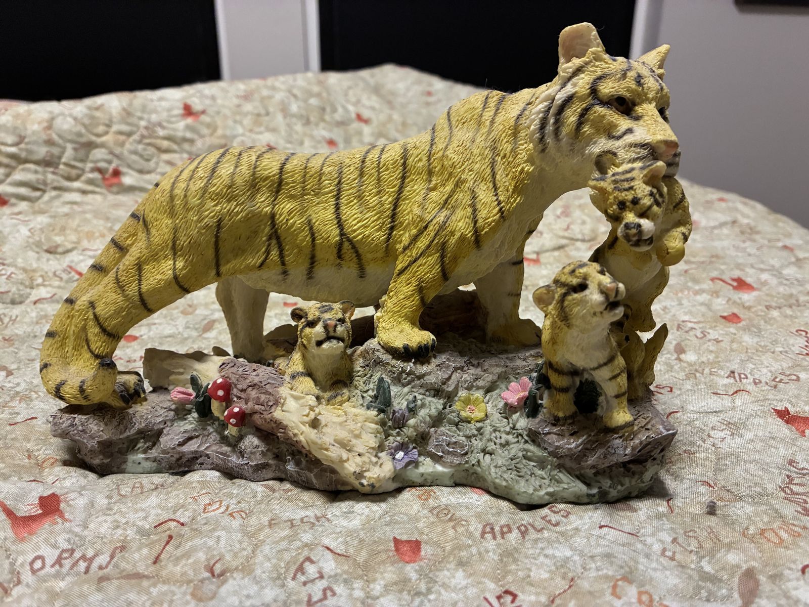 Tiger mom and cubs statue