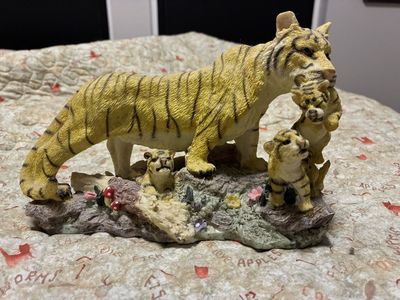 Tiger mom and cubs statue