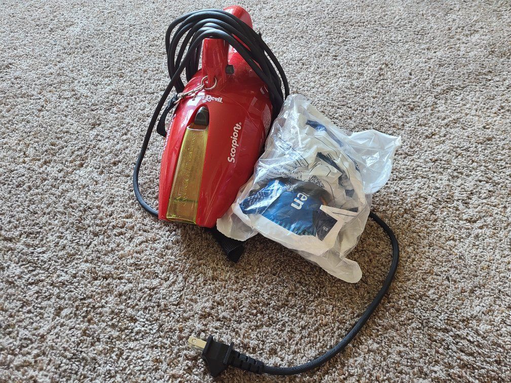 Corded hand vacuum with filters