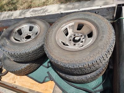 set of 235/75R15 tires and rims
