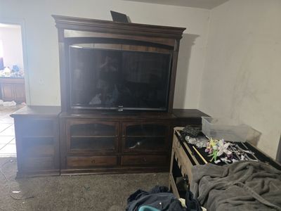 9ft entertainment center & 65" tv