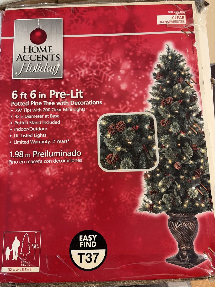 Home Accents Holiday 6.5 ft Pre-Lit Potted Pine Tree with Decorations